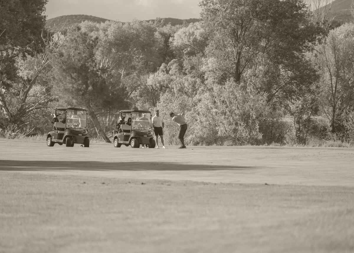 Golf carts heading down the fairway